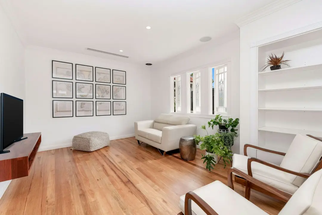 Renovated living room with white walls and period details