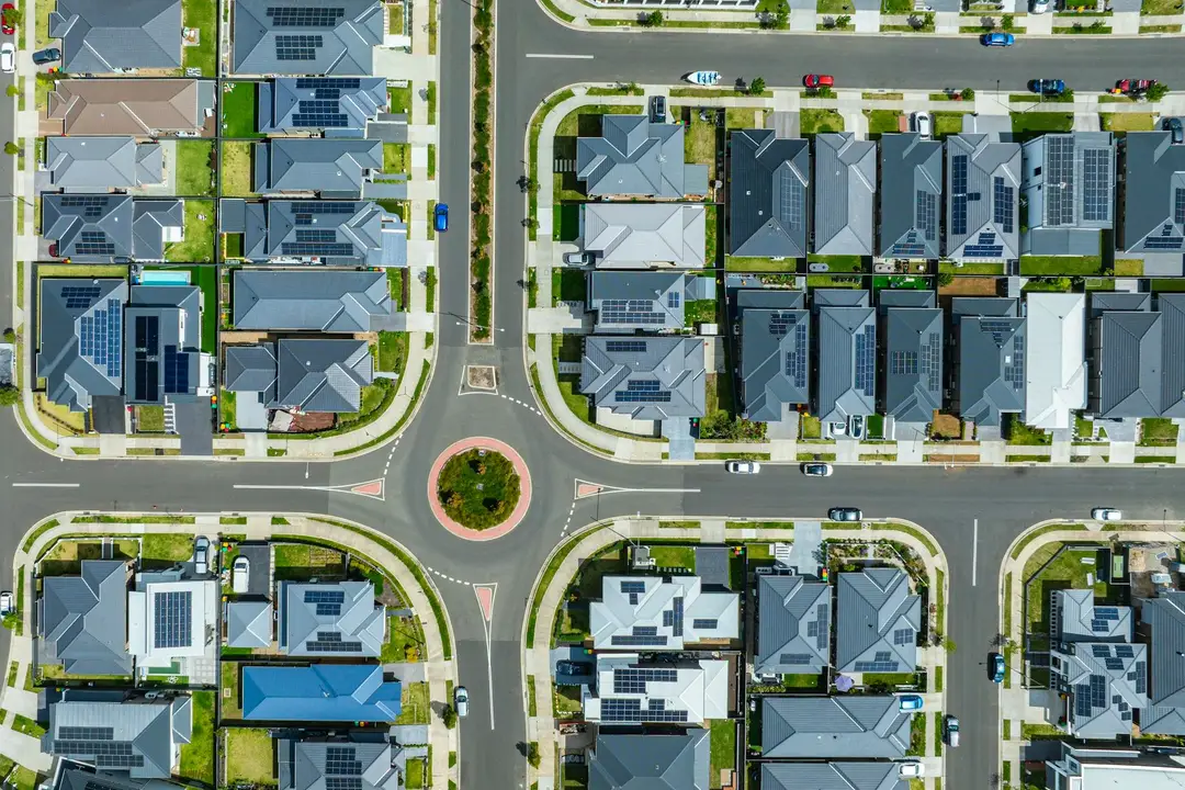 Aerial view of suburban homes around a roundabout