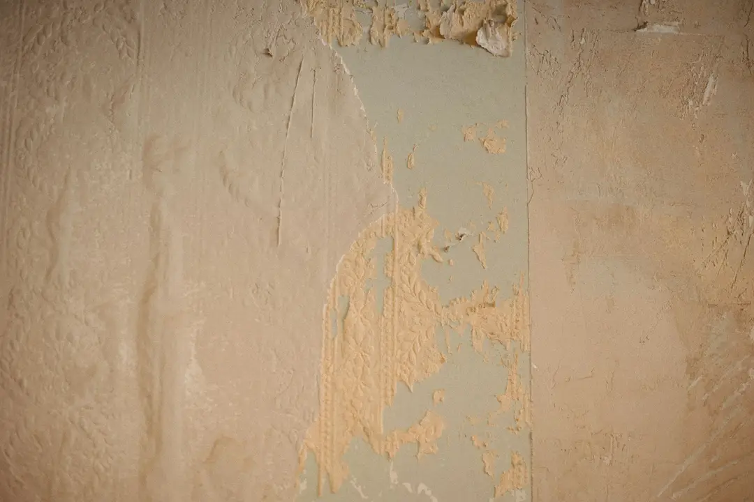 Close-up of a worn wall with flaking paint