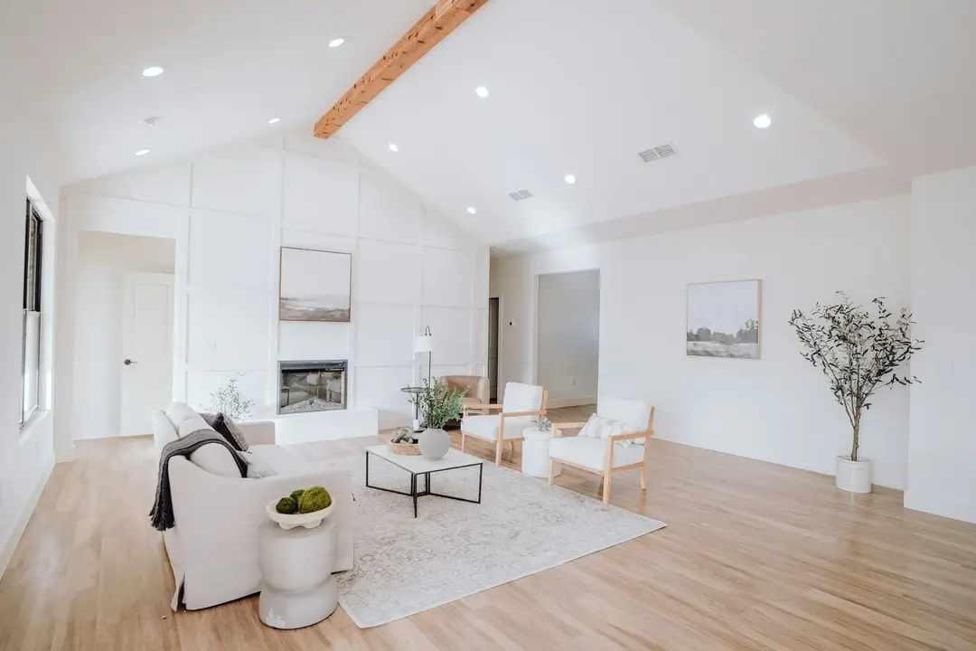 Bright new living room with white walls and timber floors