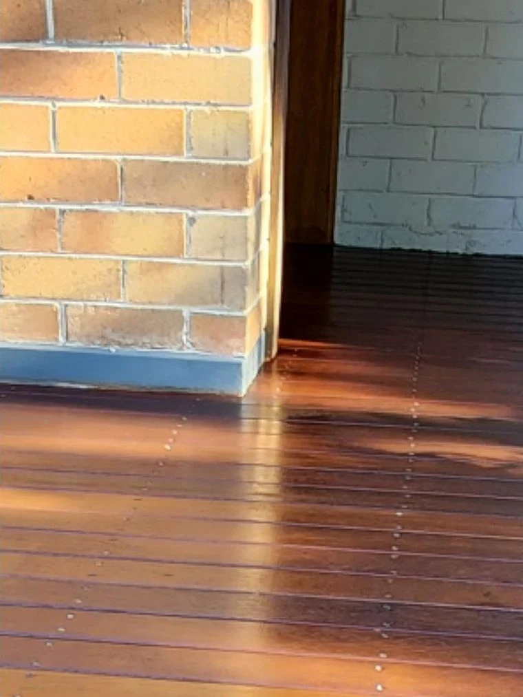 After: Timber deck, weathered boards to a fresh stained finish